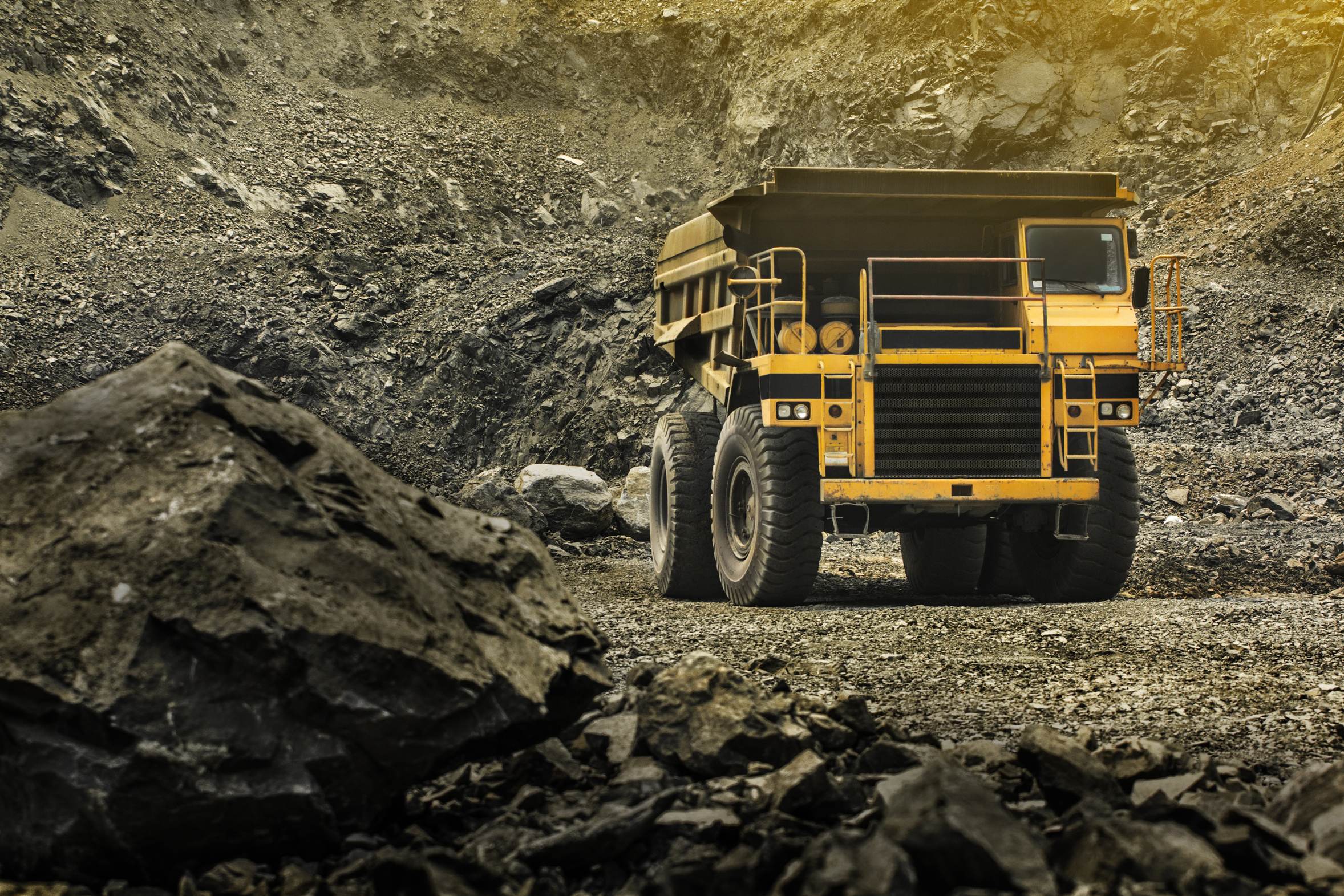A large mining haul truck on a rocky site, the kind of heavy mobile equipment a walk-around pre-check covers.